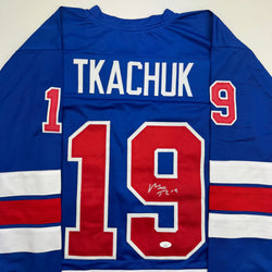 Autographed/Signed Matthew Tkachuk USA United States 2026 Olympics Gold Medal Blue Hockey Jersey JSA COA