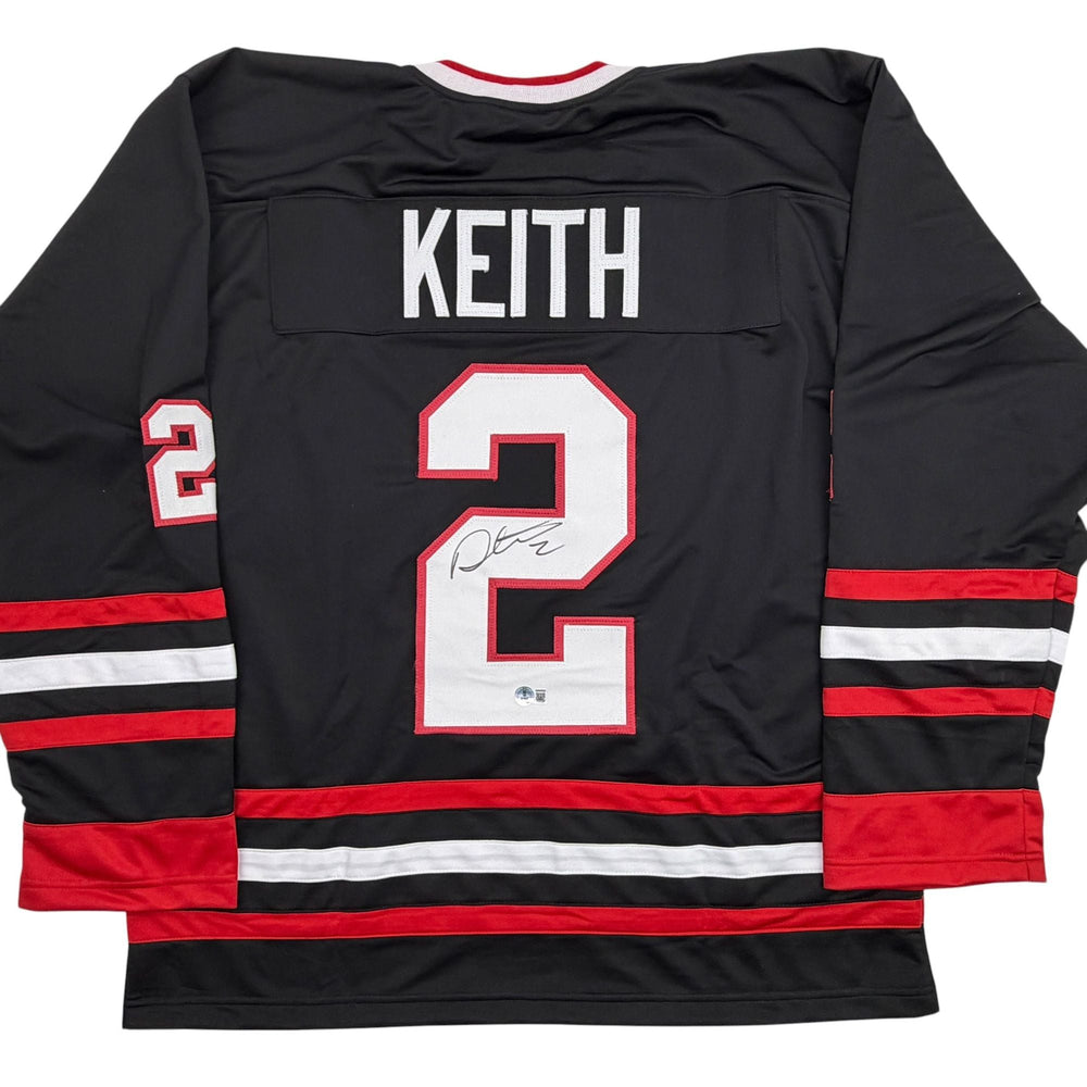 Autographed/Signed Duncan Keith Chicago Black Hockey Jersey Beckett BAS COA