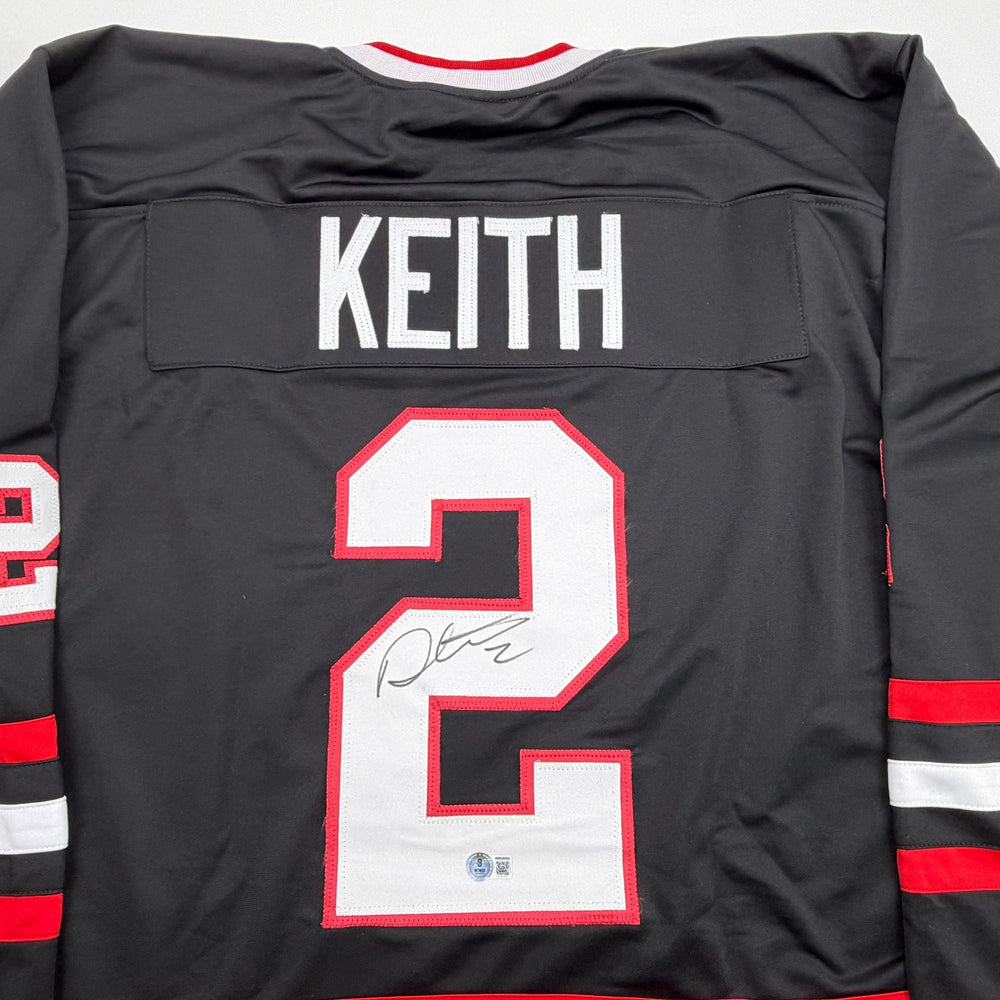Autographed/Signed Duncan Keith Chicago Black Hockey Jersey Beckett BAS COA