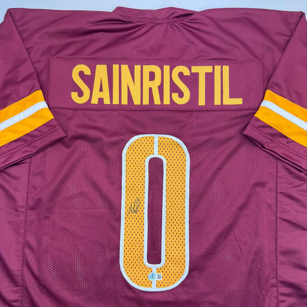 Autographed/Signed Mike Sainristil Washington Burgundy Football Jersey Beckett BAS COA