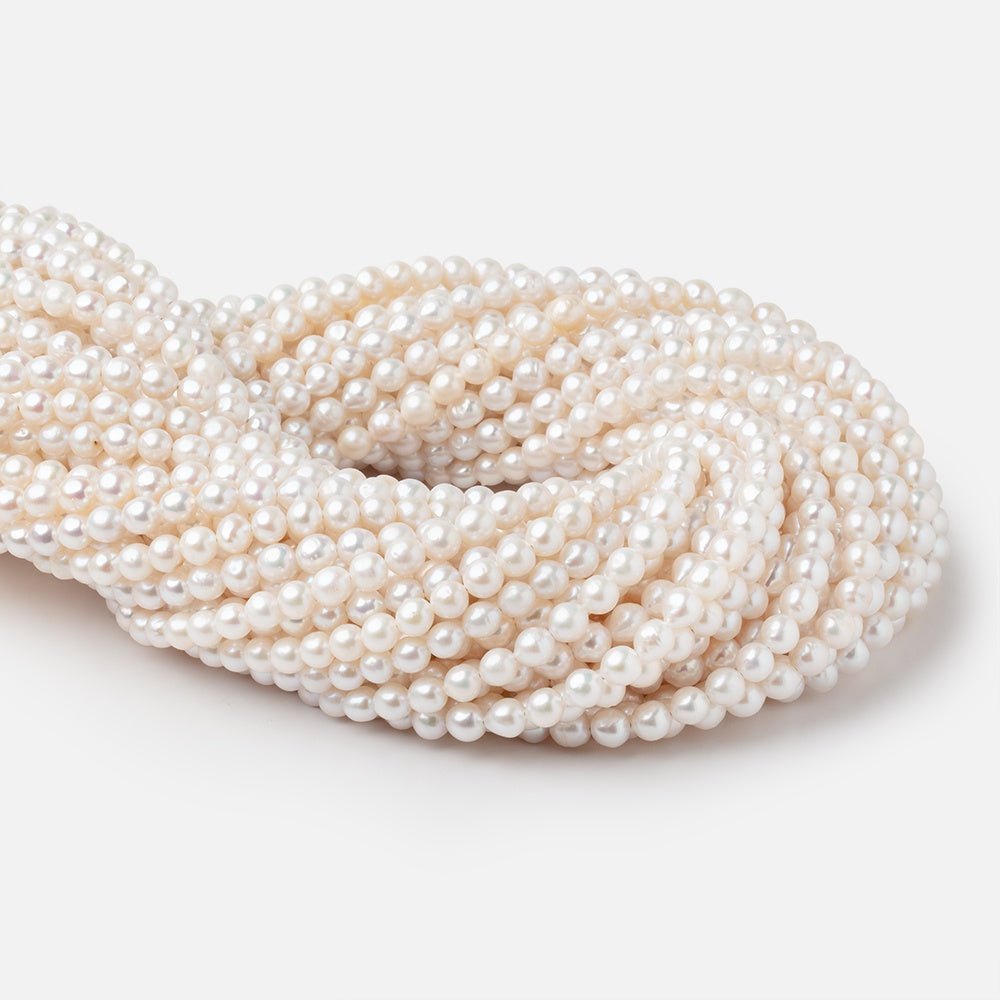 5-5.5mm Creamy White Petite Baroque Freshwater Pearls 15 inch 70 Beads