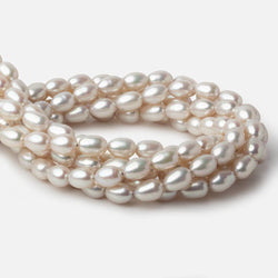 7x9-7x10mm Silver Champagne Straight Drill Oval Freshwater Pearl 16 inch 40 pieces A (ONLINE ORDER ONLY)