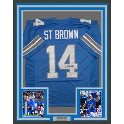 Framed Autographed/Signed Amon-Ra St. Brown 35x39 Detroit Current Blue Football Jersey Beckett BAS COA