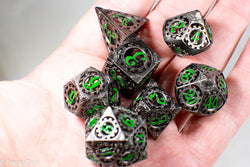 Gun Metal Hollow Gear Dice with Green Numbers 7-Dice Set (Online Only)