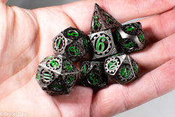 Gun Metal Hollow Gear Dice with Green Numbers 7-Dice Set (Online Only)