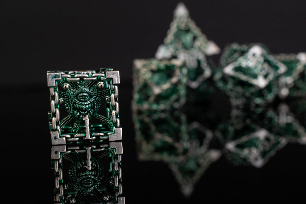 Beholder's Gates Hollow Metal Dice Set - Green and Silver (ONLINE ORDER ONLY)