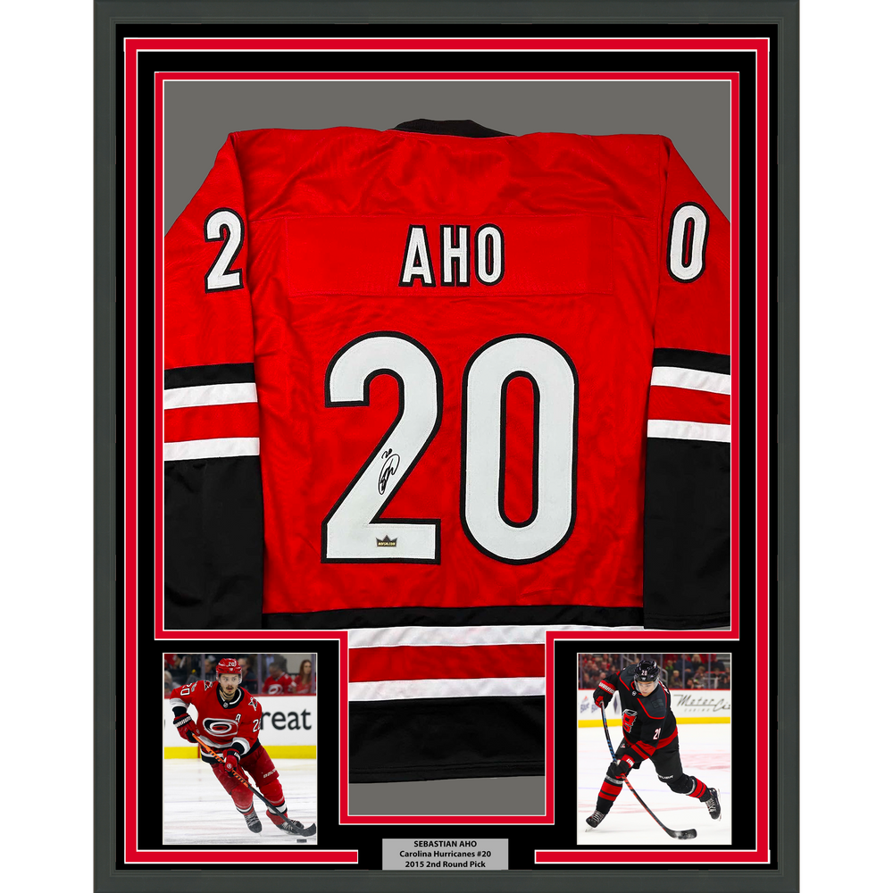 Framed Facsimile Autographed Sebastian Aho 35x39 Carolina Red Reprint Laser Auto Hockey Jersey (ONLINE ORDER ONLY)